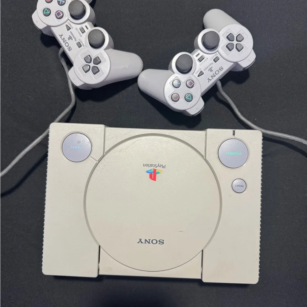 Sony PlayStation Console with Dual White Controllers
